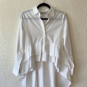 Poplin white shirt. Ruffled hi-lo top